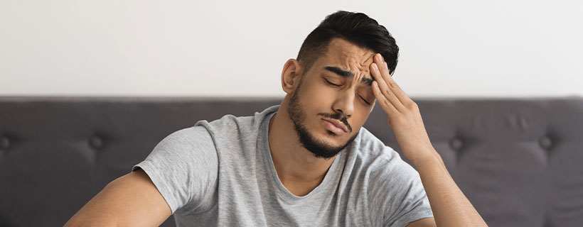 patient needing headache chiropractor in Charlotte, NC